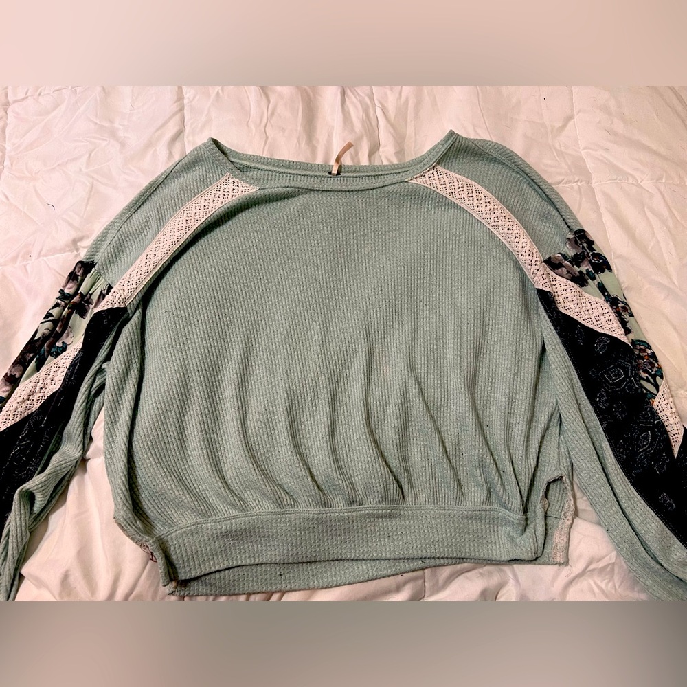 Free People sweater with floral and lace sleeves